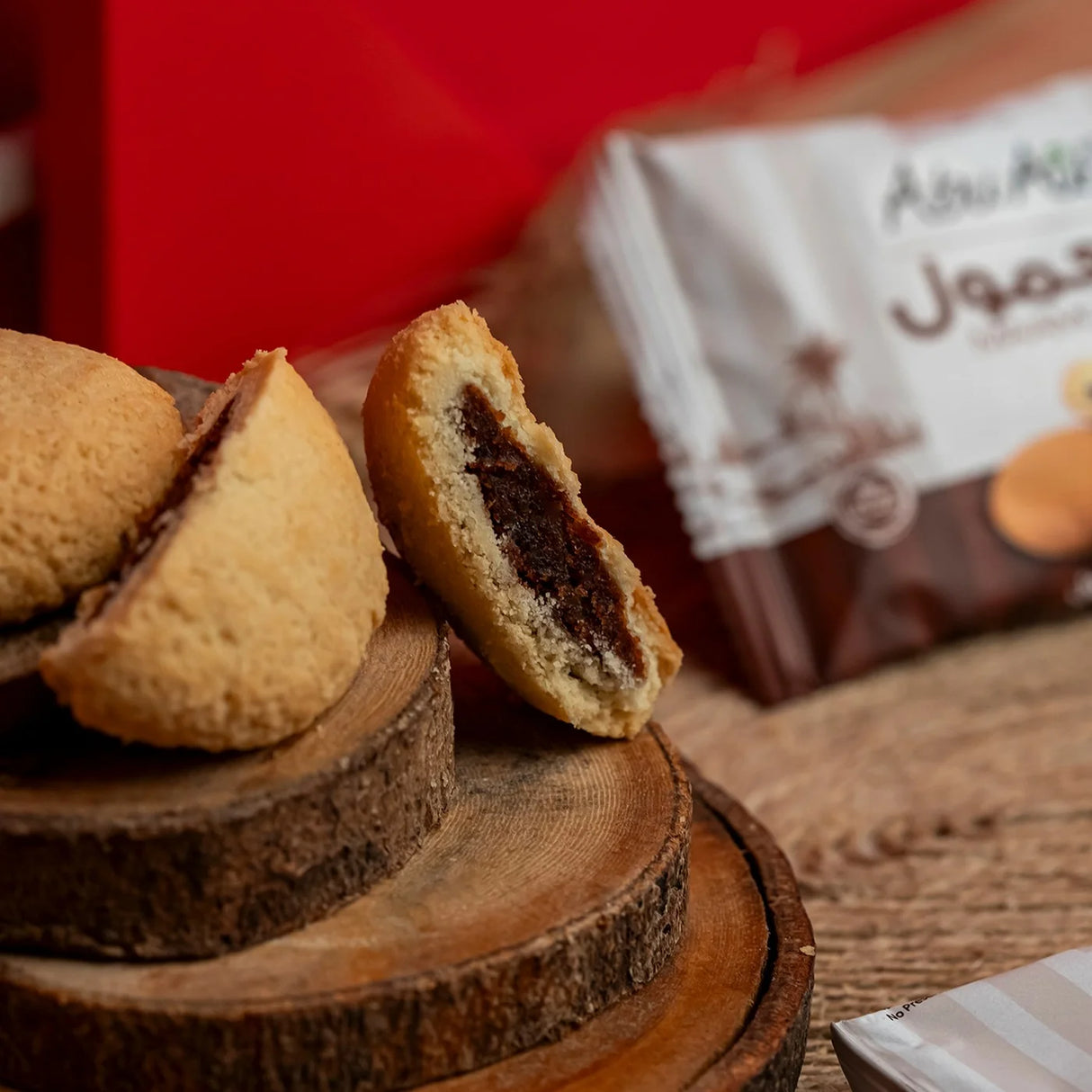 Split maamoul cookie with visible Medjool date filling from Elsouk