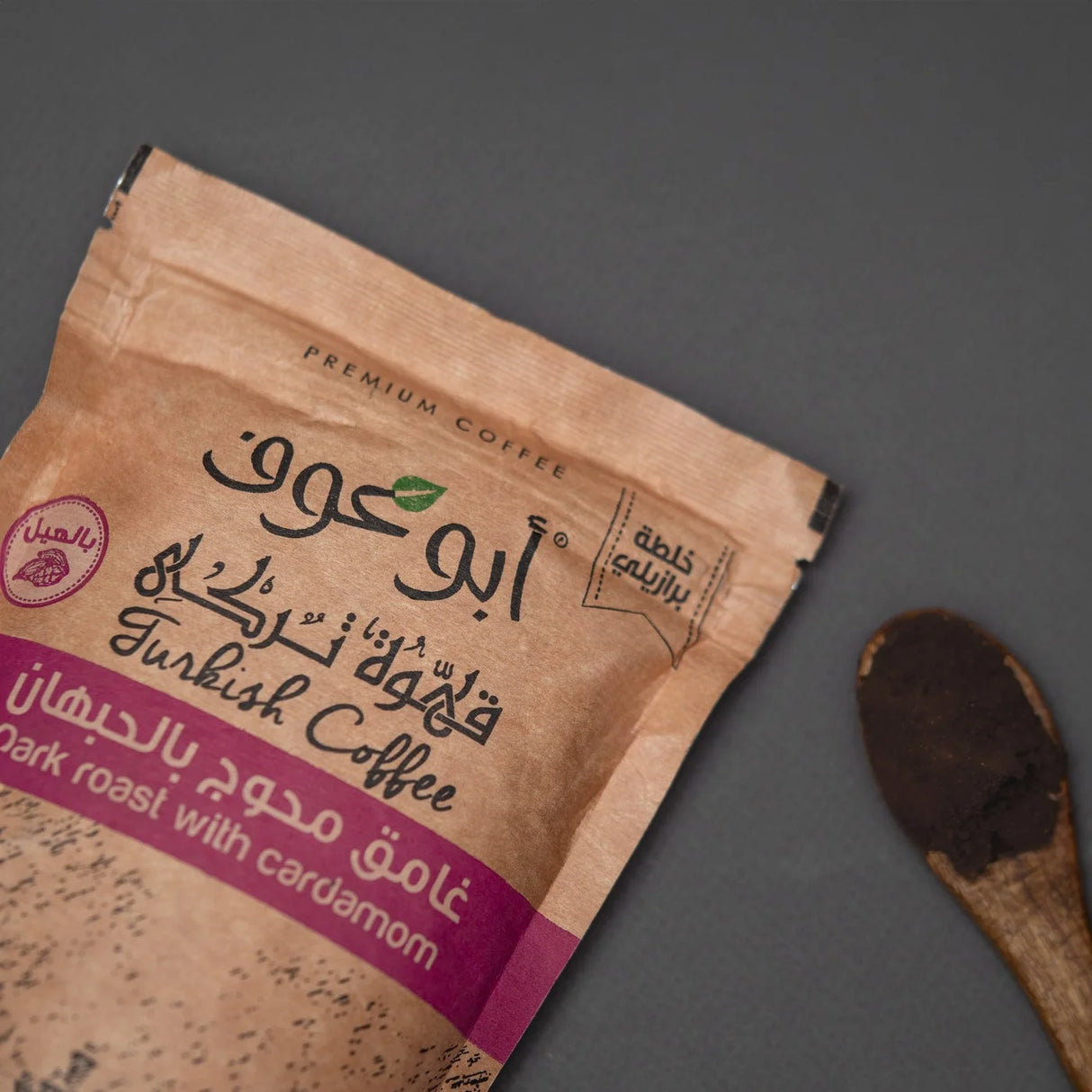 Shakk Coffee dark roast bag angled beside wooden spoon from Elsouk