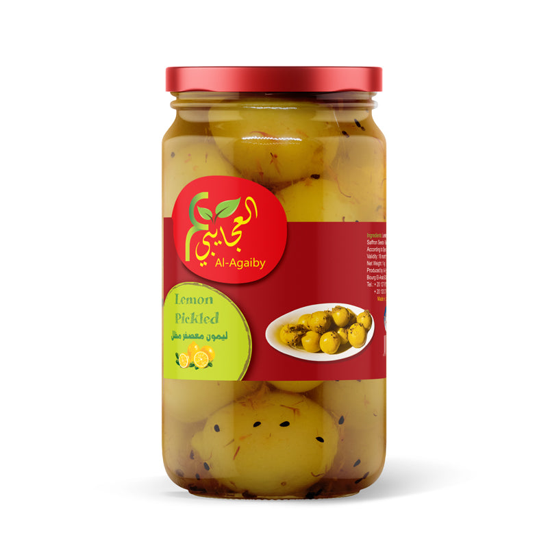 Jar of Elsouk Lemon Pickled ليمون معصفر with bright yellow pickled lemons in brine, ready for culinary use.