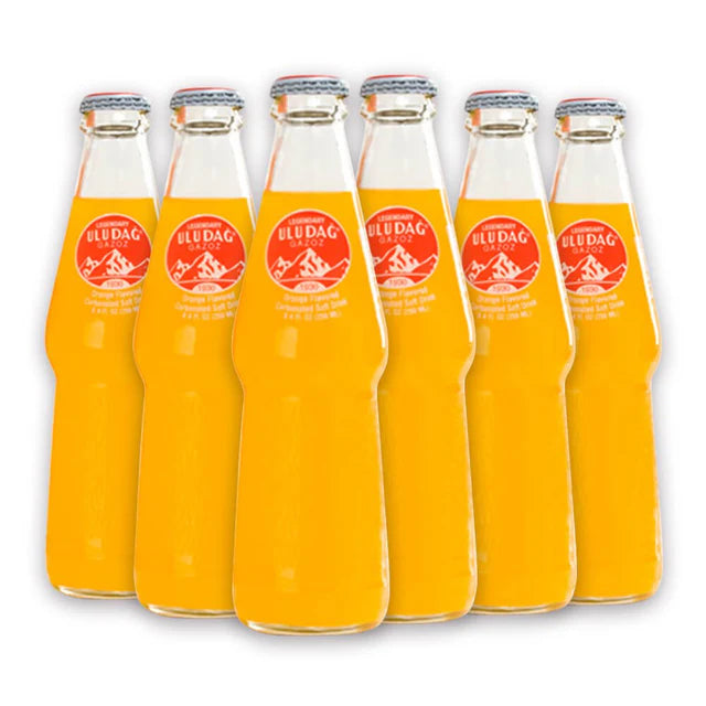 Uludag Legendary Uludag Gazoz orange flavored soft drink in a 620ml bottle with vibrant orange label and branding.