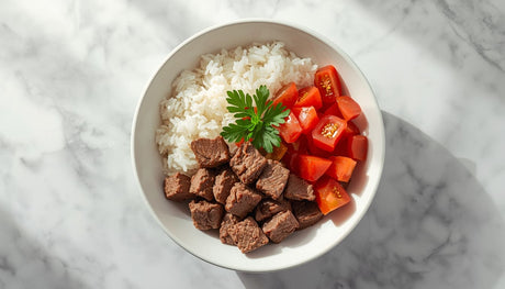Beef rice bowl with white rice beef cubes and fresh diced tomatoes now