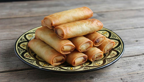 Goulash with Cottage Cheese rolls fried until golden and served on a ceramic plate