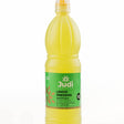Judi Lemon Juice 1L bottle with fresh lemons and juice pouring into a glass, showcasing the product's natural lemon flavor.