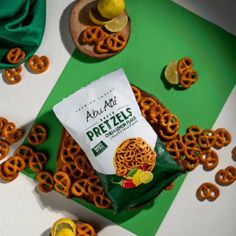 Pretzels chili lemon snack scattered with green wrap and bag Elsouk