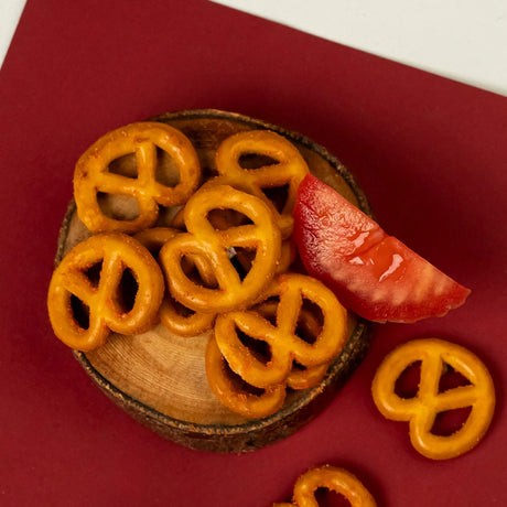 Ketchup pretzels served on bread slice with pepper garnish Elsouk