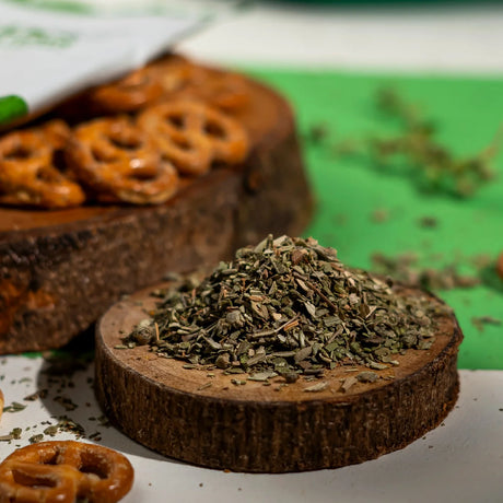 Ground thyme on wooden slice with baked pretzels around from Elsouk