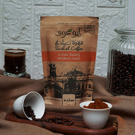 Abu Auf plain medium roast coffee pack styled with cups at Elsouk