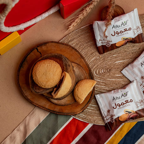 Mini packs of Medjool maamoul in bowl with colorful mat Elsouk