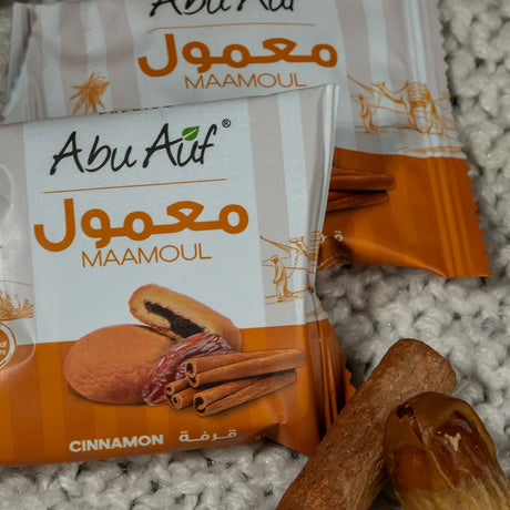 Abu Auf Maamoul with Dates and Cinnamon, 12-piece treat box, traditional Middle Eastern sweet pastries, displayed in a box.