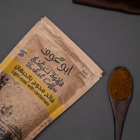Light roast Shakk Coffee angled pack and wooden spoon at Elsouk