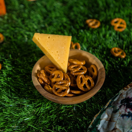 Pretzels cheese flavor and triangle cheese in bowl photo by Elsouk
