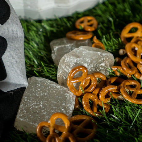 Sea salt pretzels near decorative stones for product setup at Elsouk