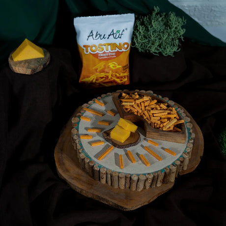 Tostino cheese sticks around cheese cube on wood plate from Elsouk