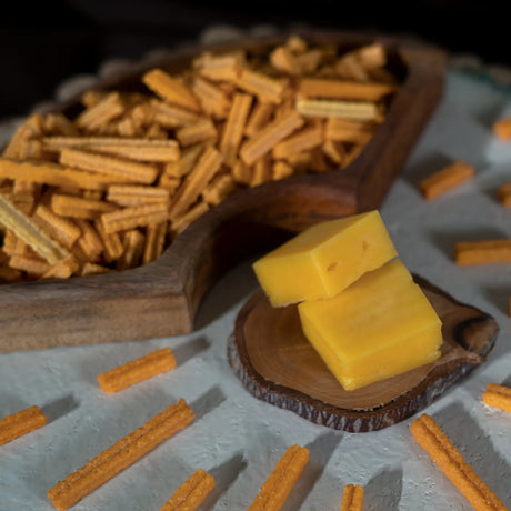 Cheese flavored Tostino sticks with cheese chunk in bowl at Elsouk