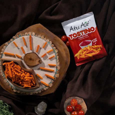 Tostino ketchup flavor snack arranged on wooden plate by Elsouk