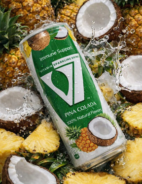 V7 Piña Colada Sparkling Drink 300ml bottle with vibrant pineapple and coconut flavor label, carbonated beverage in clear glass