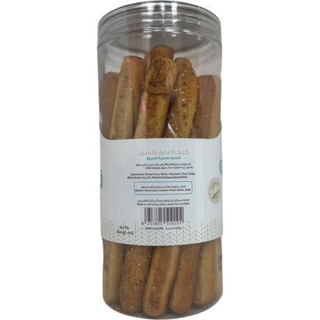 Qabalan breadsticks with anise, crispy baked snack featuring anise seeds, displayed on a white plate.