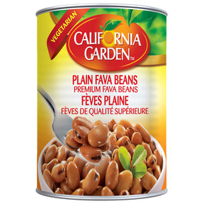 Cans of California Garden plain fava beans with white labels and metal pull tabs, ready for cooking or storage.
