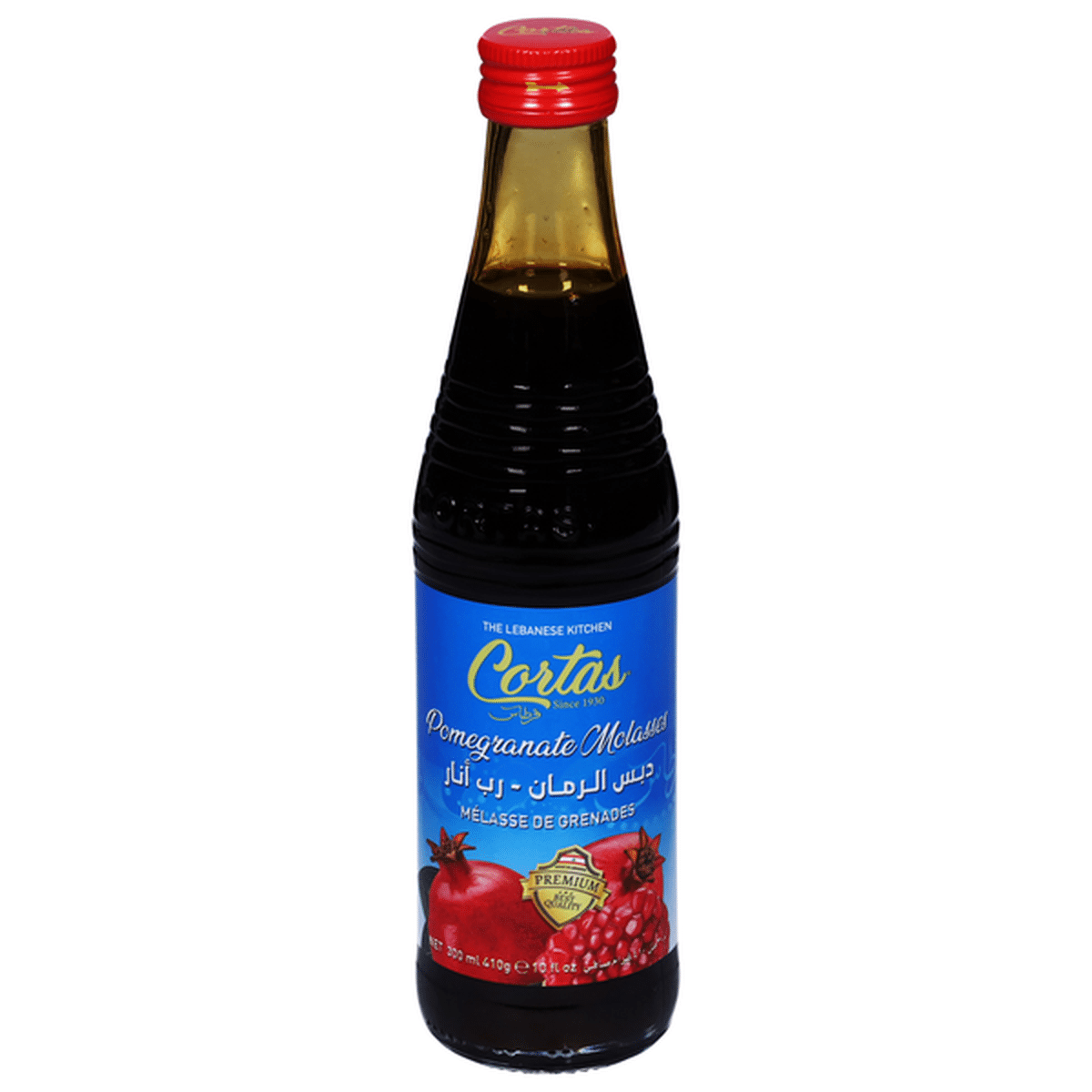 Cortas pomegranate molasses bottle with label, showing dark red, thick syrup used in cooking and baking.