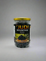 Judi black olives in a 600g package, front view, showcasing the dried, black olives with a textured surface.