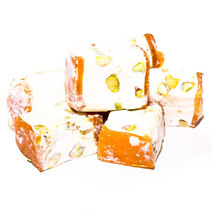 Master Delight nougat with apricot and pistachios, showcasing a creamy texture with visible fruit and nut pieces in the image.