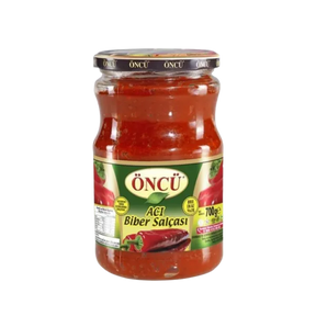 Spicy hot pepper paste in a jar by Oncu, showcasing bright red, chunky chili paste for cooking and flavoring dishes.