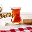 Set of six Paşabahçe tea cups with clear glass design, perfect for serving hot beverages in a stylish and elegant way.