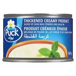 Puck thickened creamy dessert in a bowl, showing smooth, rich texture and vanilla flavor.