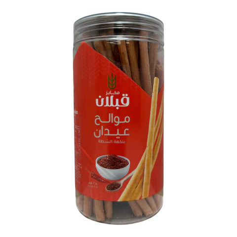 Qabalan bread sticks with salty, hot pepper flavor, featuring crunchy texture and vibrant red hot pepper seasoning.