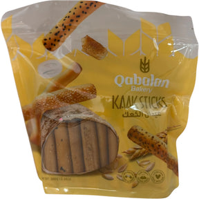 Qabalan Kaak sticks, crunchy baked bread snacks, golden brown, with sesame seeds, ideal for snacking or sharing.