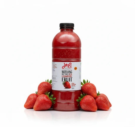 Drips Strawberry Chunky Smoothie in a clear glass, showcasing fresh strawberry chunks and vibrant red color, natural fruit juice.