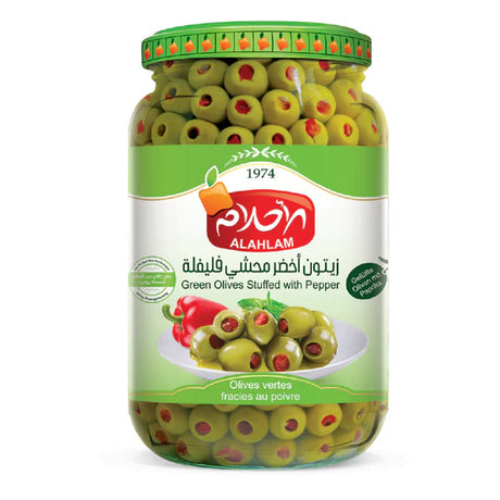 Green olives stuffed with peppers, Alahlam brand, vibrant and fresh, showcasing the colorful stuffed olive on a white background.